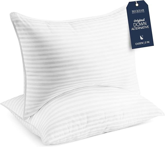 White striped pillows from the Beckham Hotel Collection Bed Pillows set shown on a plain background.