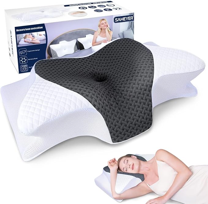A woman rests on a pillow beside a box of SAHEYER Pillows, enjoying comfort and relaxation.