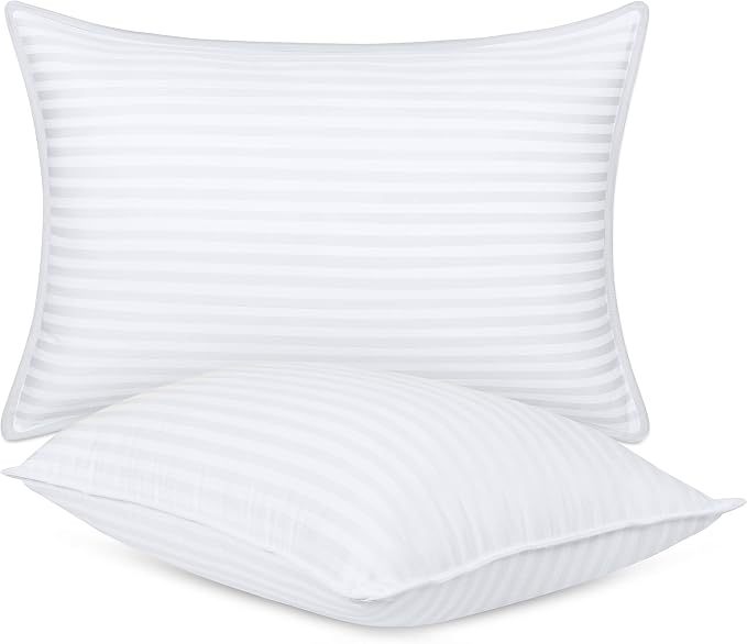 Two Utopia Bed Pillows with white stripes are displayed together, showcasing their simple and elegant design.