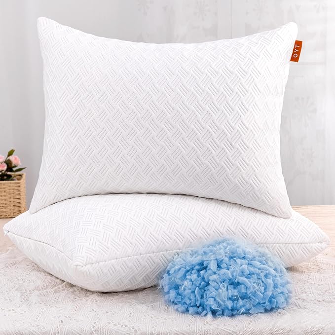 Two OYT Cooling Bed Pillows in blue and white colors are displayed together on a bed.