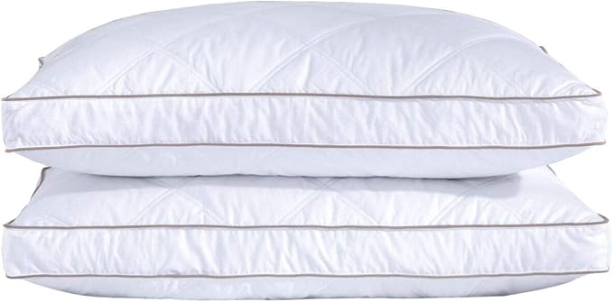 Two puredown Goose Feathers and Down Pillows stacked on top of each other, showcasing their soft and fluffy design.
