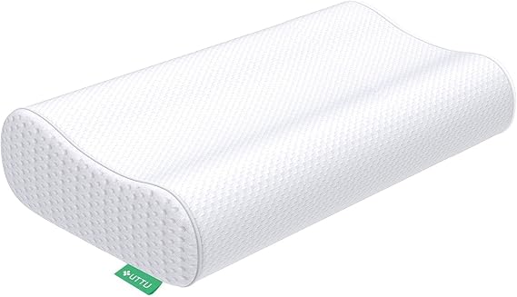 A white pillow with green dots, designed as the Cervical Pillow for Neck Pain, providing comfort and support.